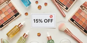 Assortment of beauty products with a 15% off discount tag, symbolizing first purchase savings.