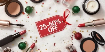 Festive beauty products with holiday decorations and a '25-50% Off' sale tag, representing holiday beauty sales.