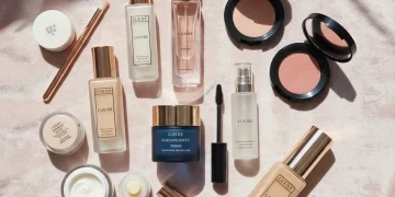 Collection of luxury skincare, makeup, and fragrance products with a sale tag